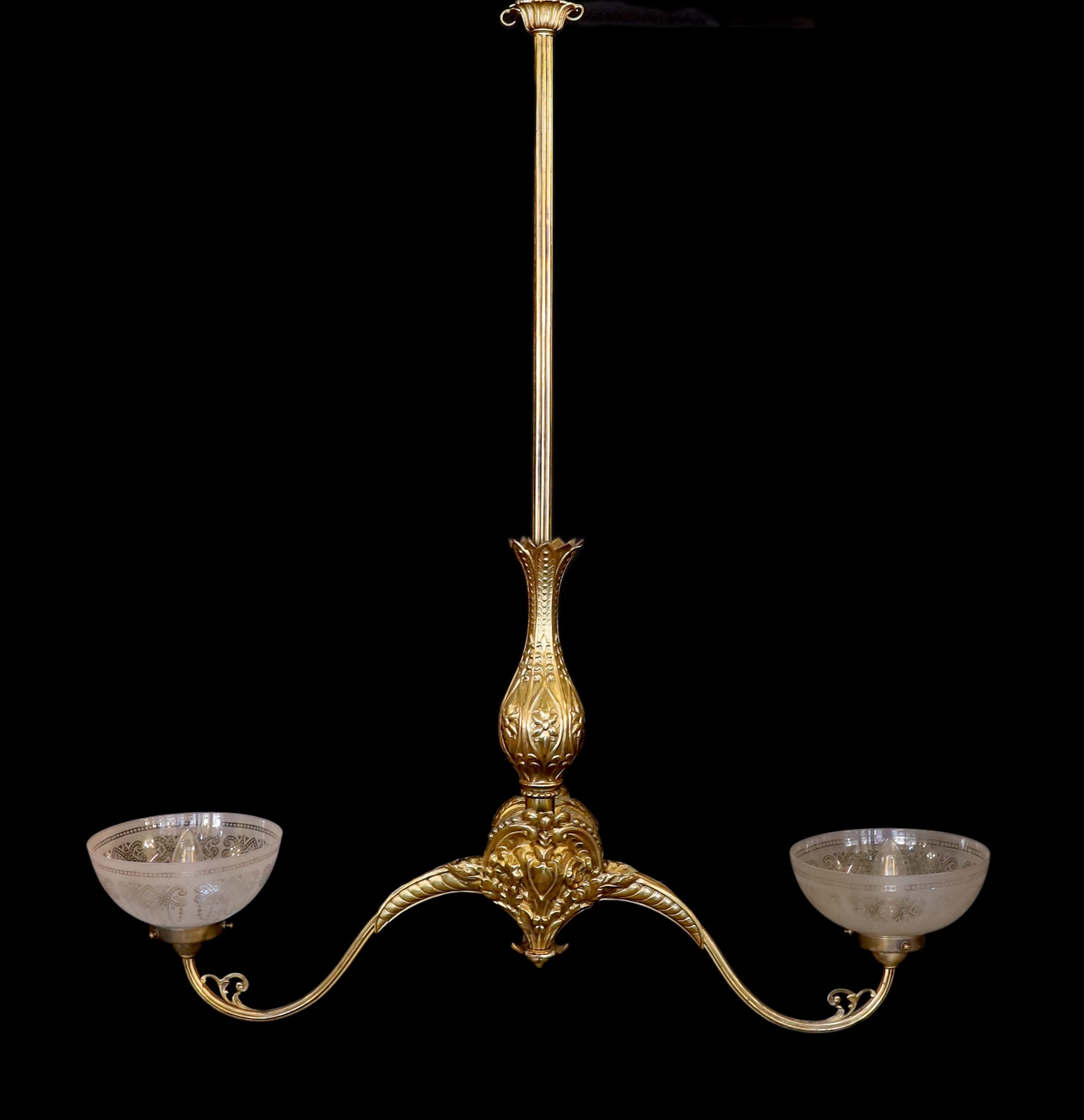 A mid 19th century brass twin branch gasolier with etched crystal glass shades, drop 100cm. width 90cm